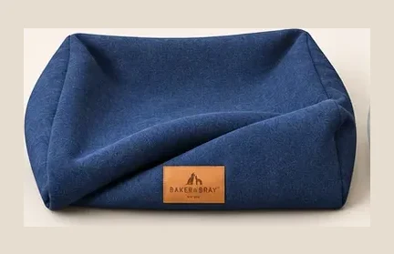 The woven fabric and leather patch on an Ultimate cover in Navy Blue